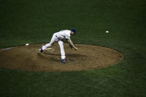 Curveball pitch mechanics and 4 proven rules that create unhittable break showing curveball pitch mechanics