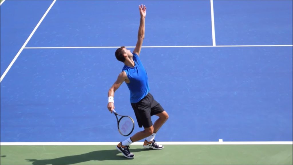 Tennis Serve Kinetic Chain Mechanics and 4 Proven Rules That Unlock Devastating Power showing tennis serve kinetic chain