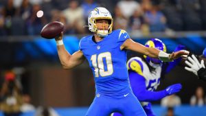 Justin Herbert Faces 4 Critical Pressures as Trade Rumors and Scary Hits Collide illustrating justin herbert